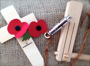 Sandbag, poppies, trench whistle and rattle